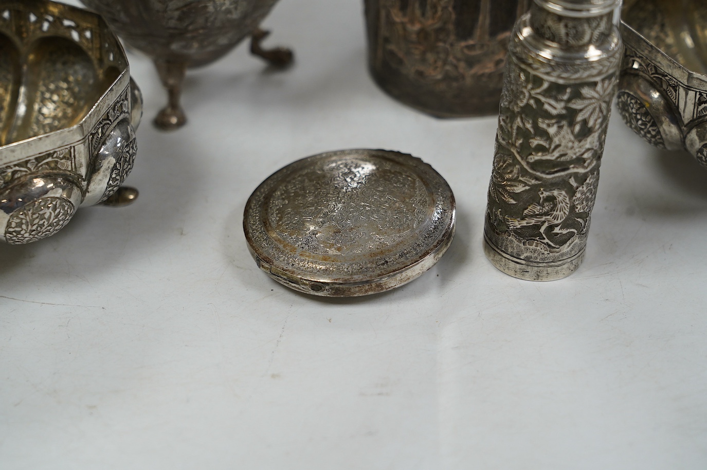 A pair of Indian pierced cusped white metal bowls, diameter 84mm, three other Indian white metal canisters and a Middle Eastern pill box. Condition - fair